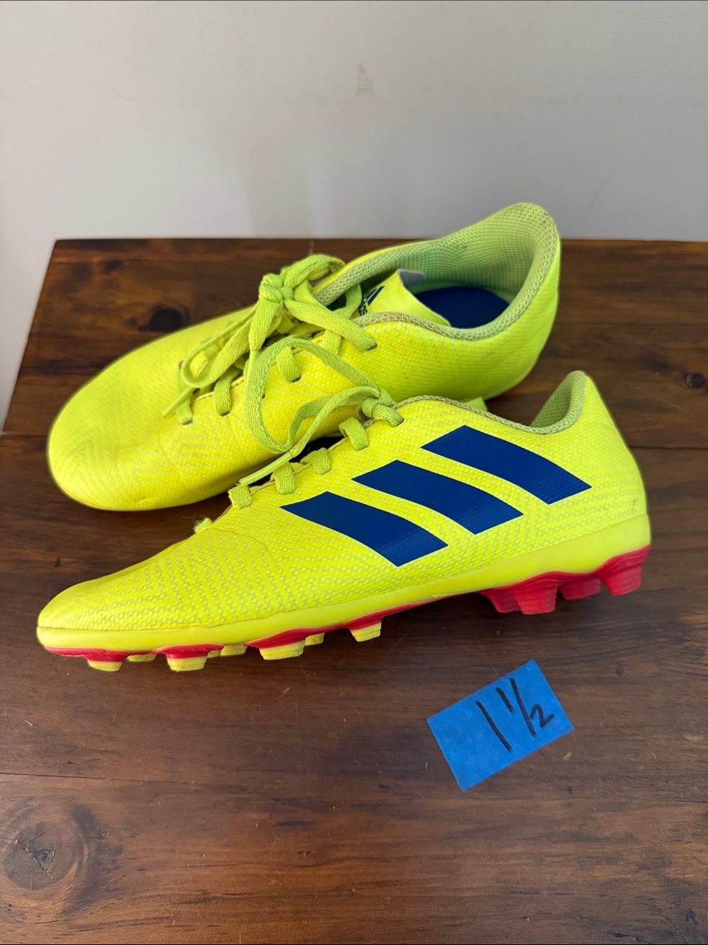 adidas Kids Neon Yellow Soccer Cleats with Blue Stripes and Red Studs